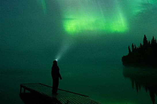  A man viewing the Aurora Borealis